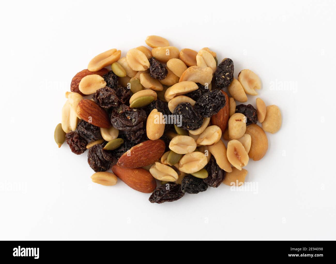 Top view of a serving of nuts and dried fruit on a white background. Stock Photo