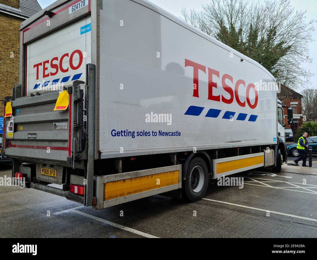 A Tesco Plc distribution lorry making a delivery to a branch of Tesco Express. Stock Photo