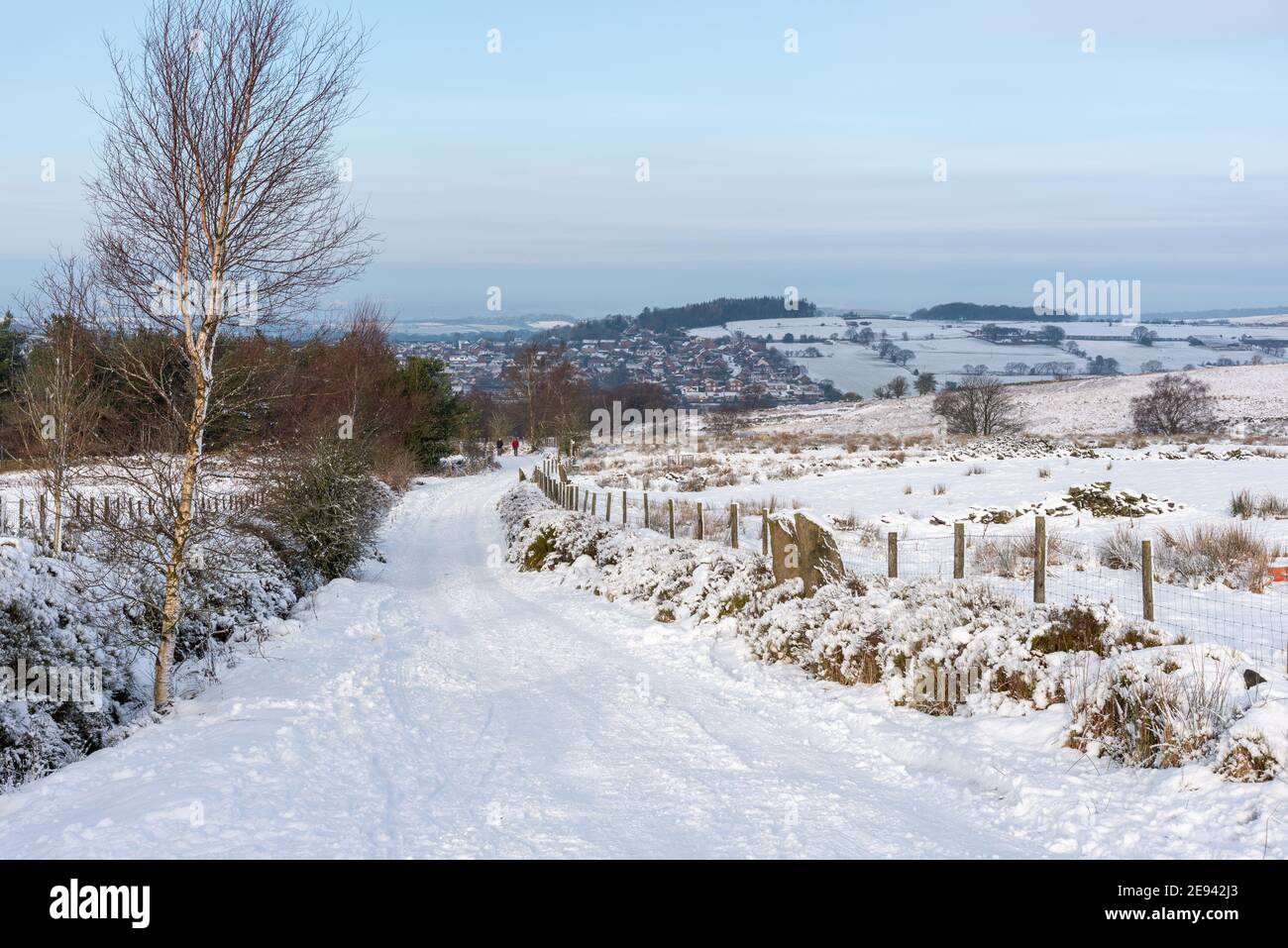 A steep snow covered road on the West Pennine Moors in Lancashire Stock Photo
