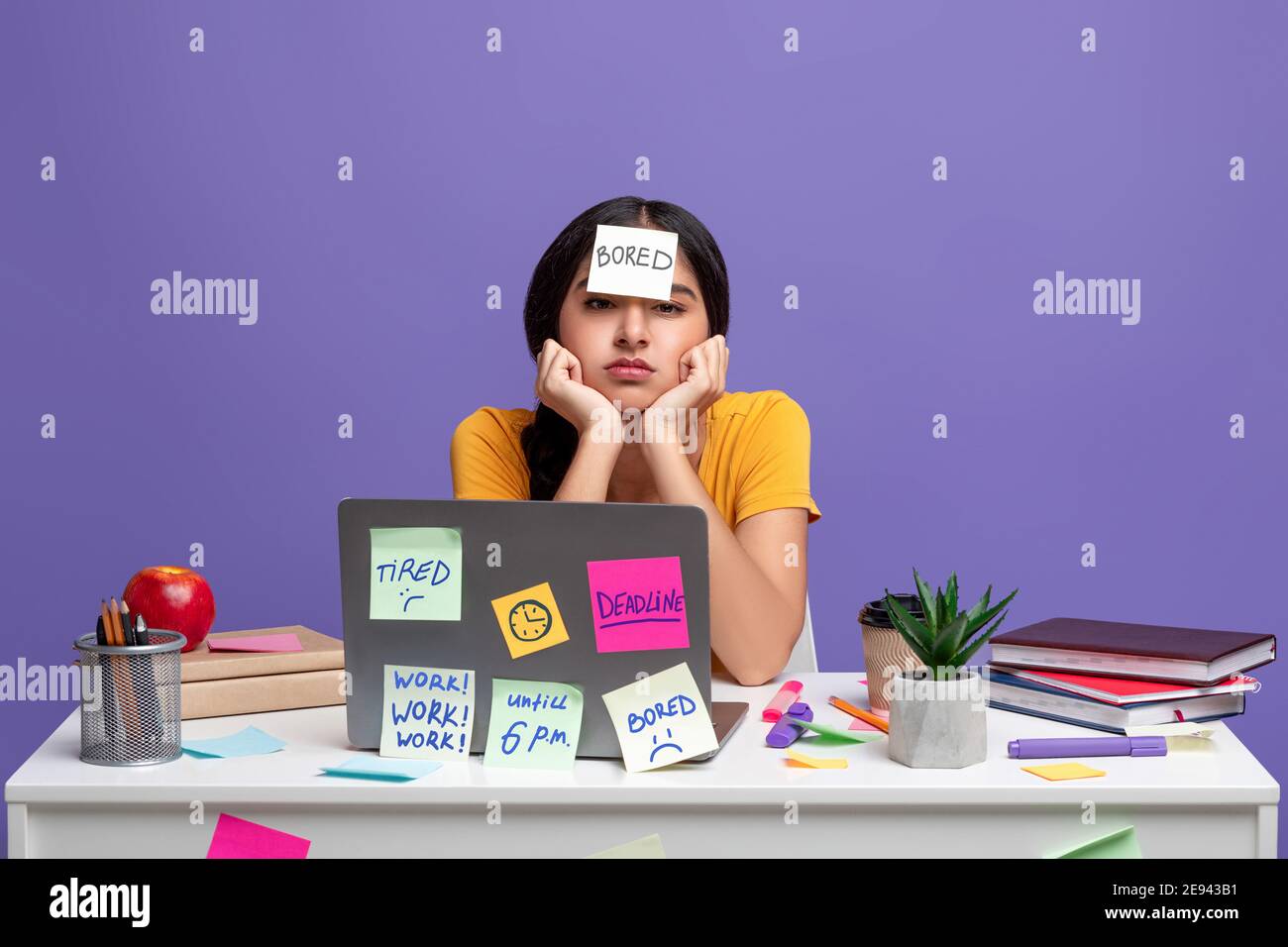 Tired indian woman sitting at desk with sticky notes Stock Photo - Alamy