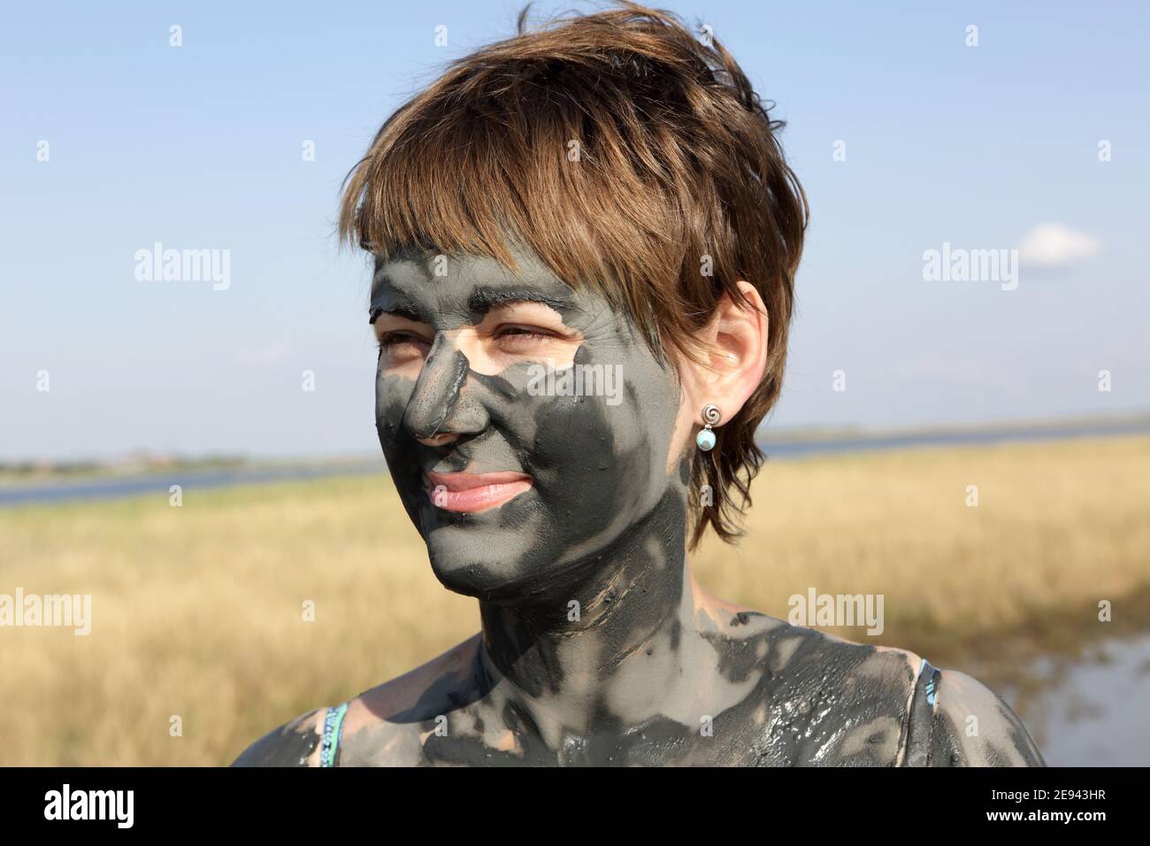 Woman covered in mud hi-res stock photography and images - Alamy