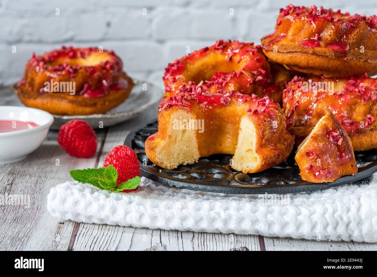 Mini vanilla pound cakes with raspberry icing Stock Photo