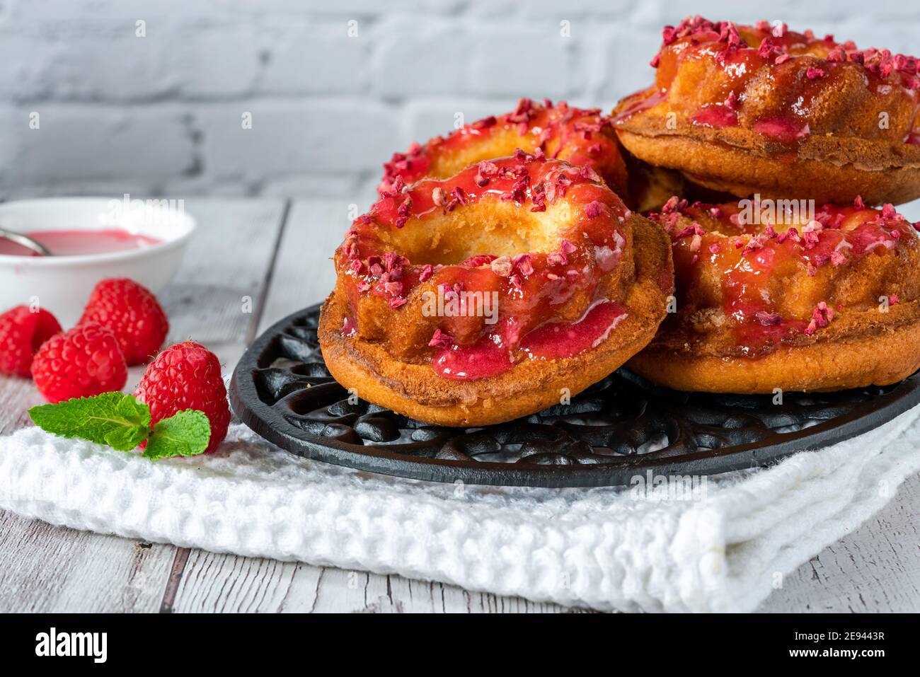 Mini vanilla pound cakes with raspberry icing Stock Photo