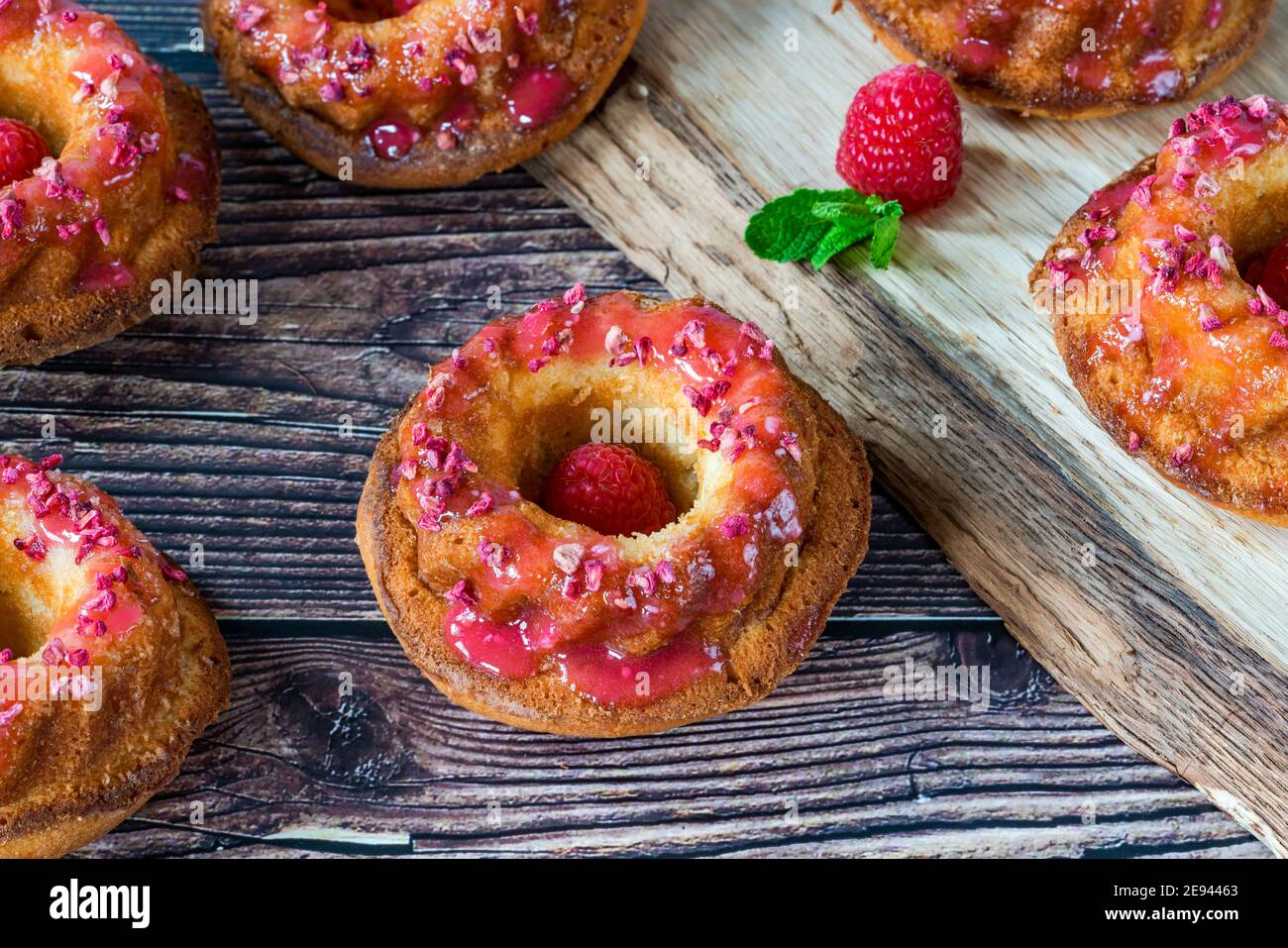 Mini vanilla pound cakes with raspberry icing Stock Photo