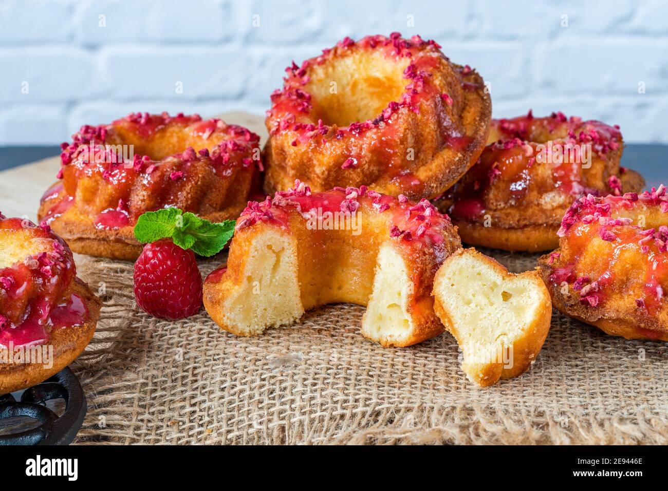 Mini vanilla pound cakes with raspberry icing Stock Photo