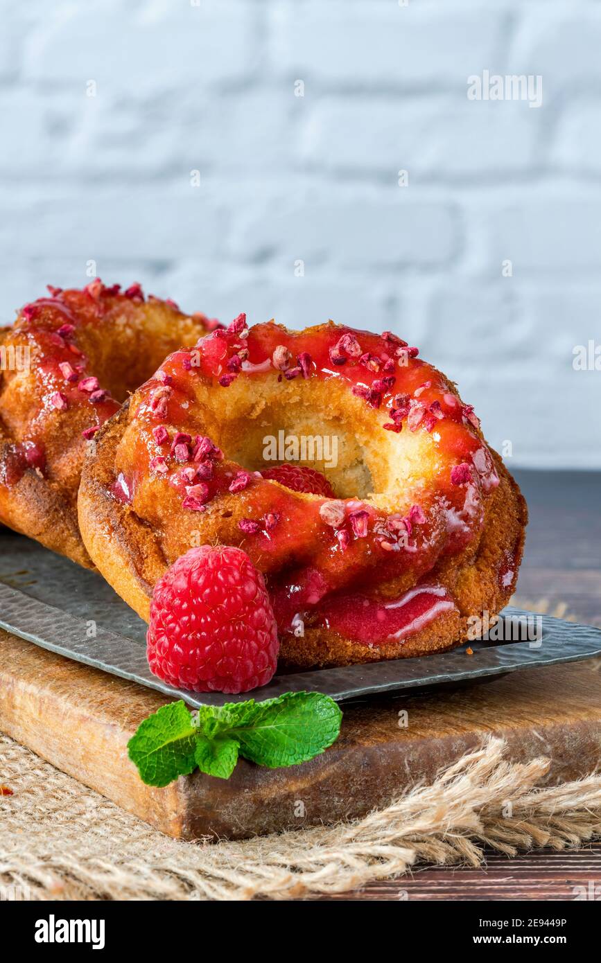 Mini vanilla pound cakes with raspberry icing Stock Photo