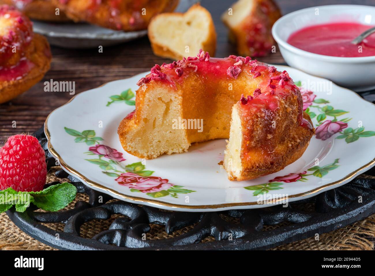 Mini vanilla pound cakes with raspberry icing Stock Photo