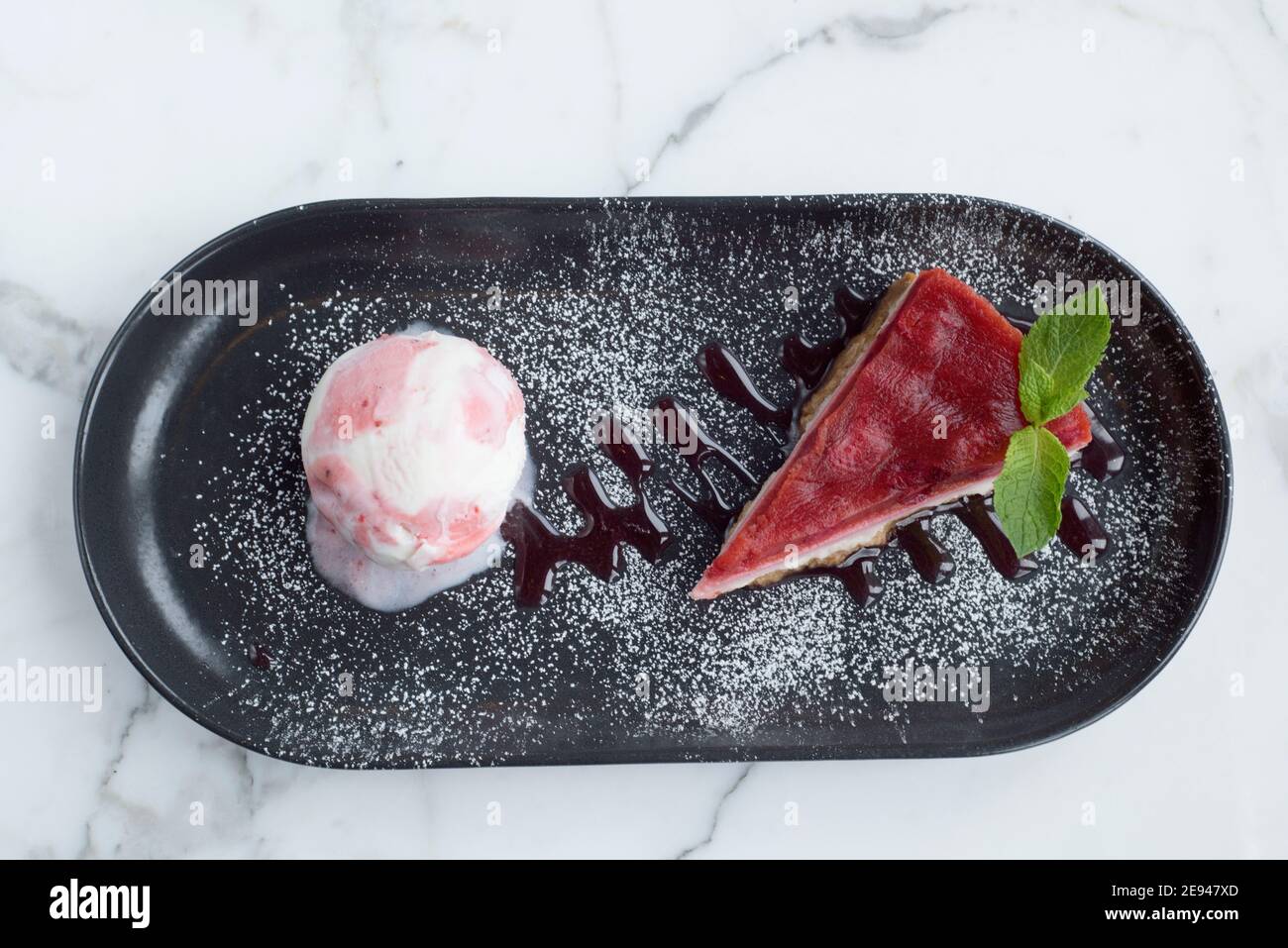 Sheffield, UK - 03 Aug 2017: Strawberry cheesecake and ice cream desert at OHM, Fitzwilliam Street Stock Photo