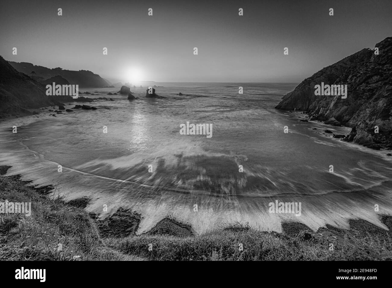 Black and white panoramic view of Playa del Silencio, in Asturias, Spain, at sunset Stock Photo