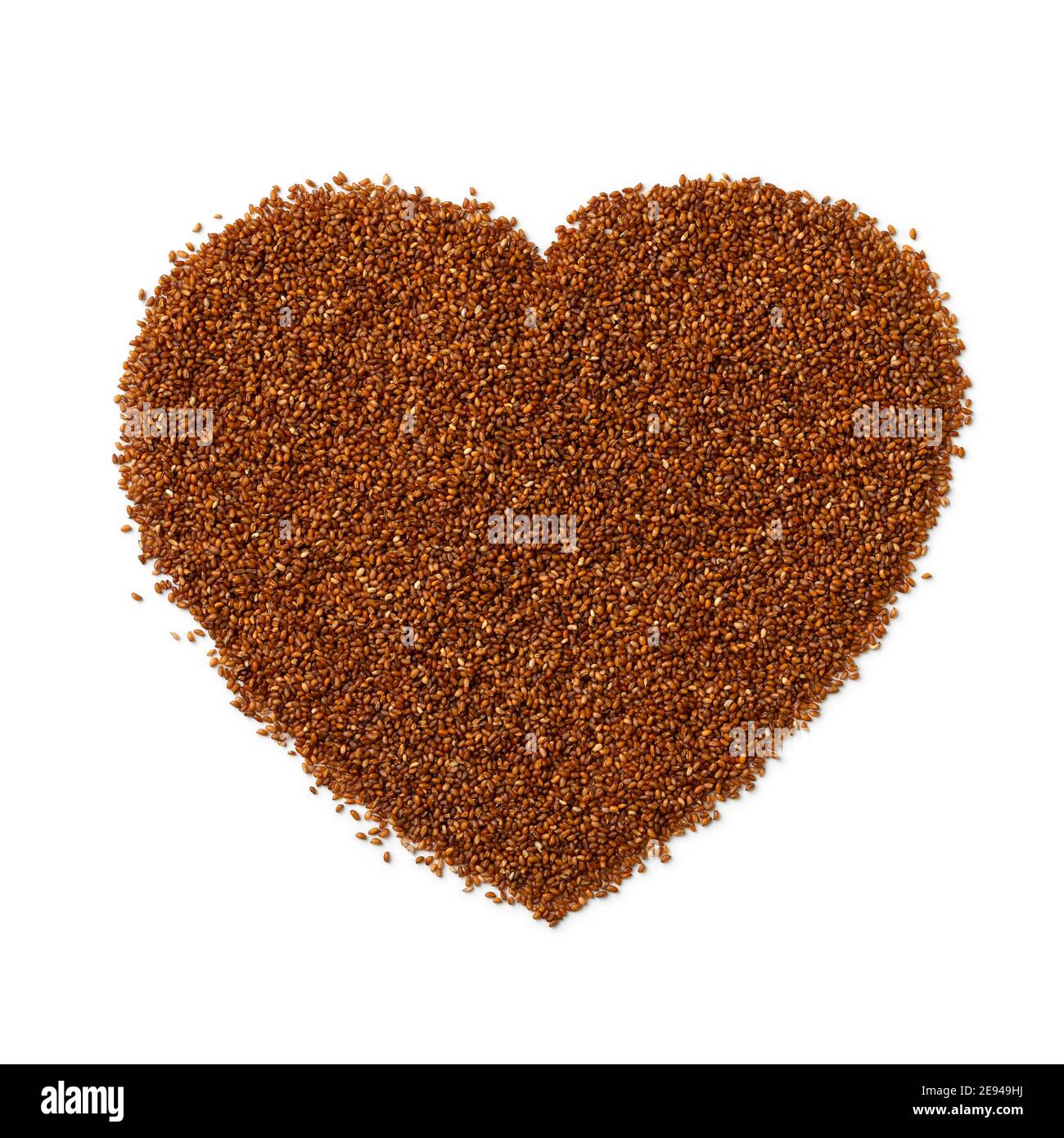 Raw teff seed in heart shape isolated on white background Stock Photo