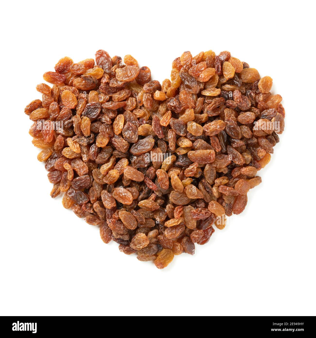 Healthy sweet sundried raisins in heart shape isolated on white background for Valentines day Stock Photo