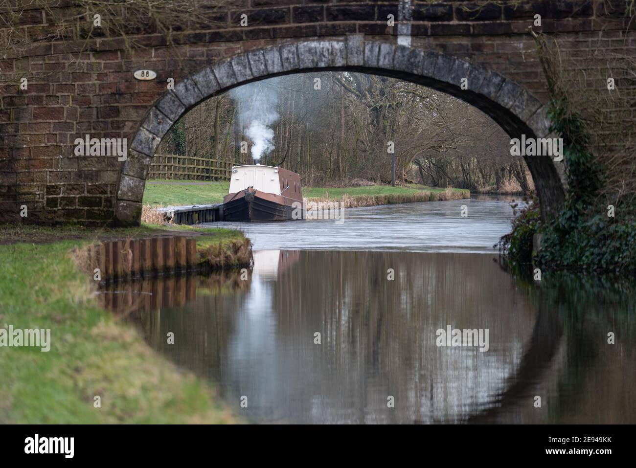 A single narrowboat moored on the Leeds Liverpool canal at Withnell Fold in Lancashire Stock Photo