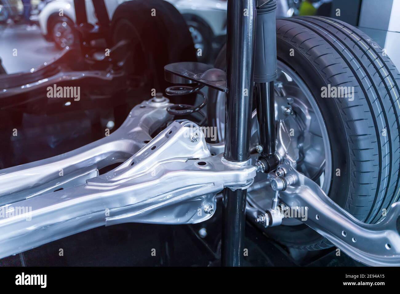 electric system of eco car front driving axle in the car, visible elements of the steering system Stock Photo