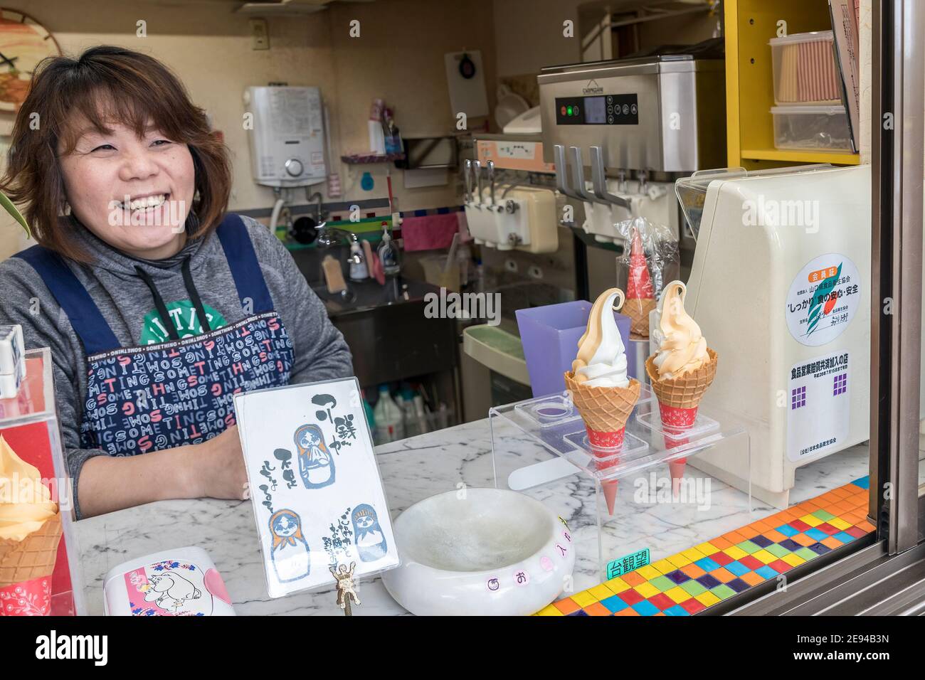 Woman selling ice cream from kiosk, Akiyoshidai plateau, Yamaguchi, Japan Stock Photo