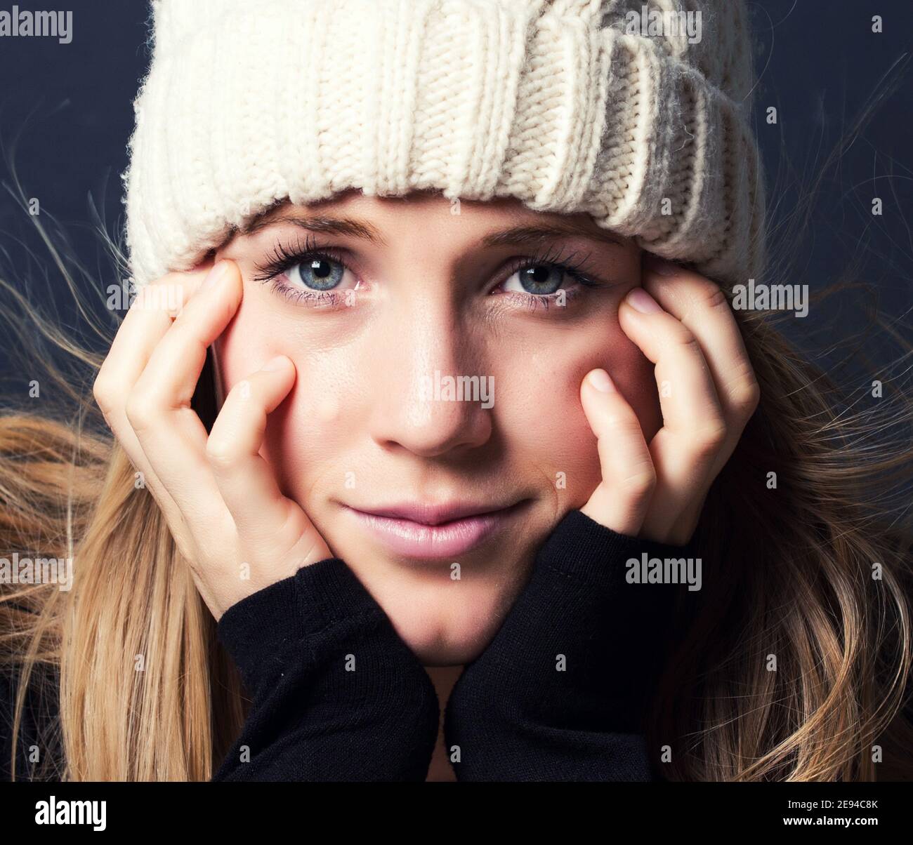 YOUNG WOMAN PORTRAIT PHOTOGRAPHY WITH WHITE CAP Stock Photo