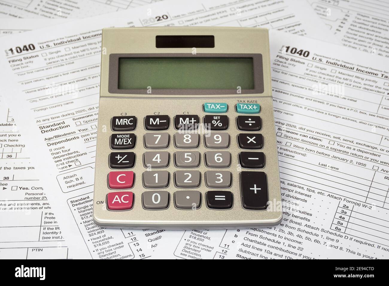 calculator with blank screen on 2020 Internal Revenue Service 1040 tax forms Stock Photo