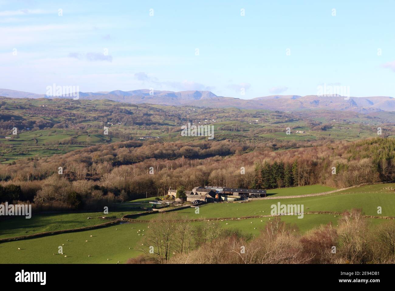 View over the Lyth Valley Cumbria looking west from Scout Scar towards the fells of the Lake District National Park. Stock Photo