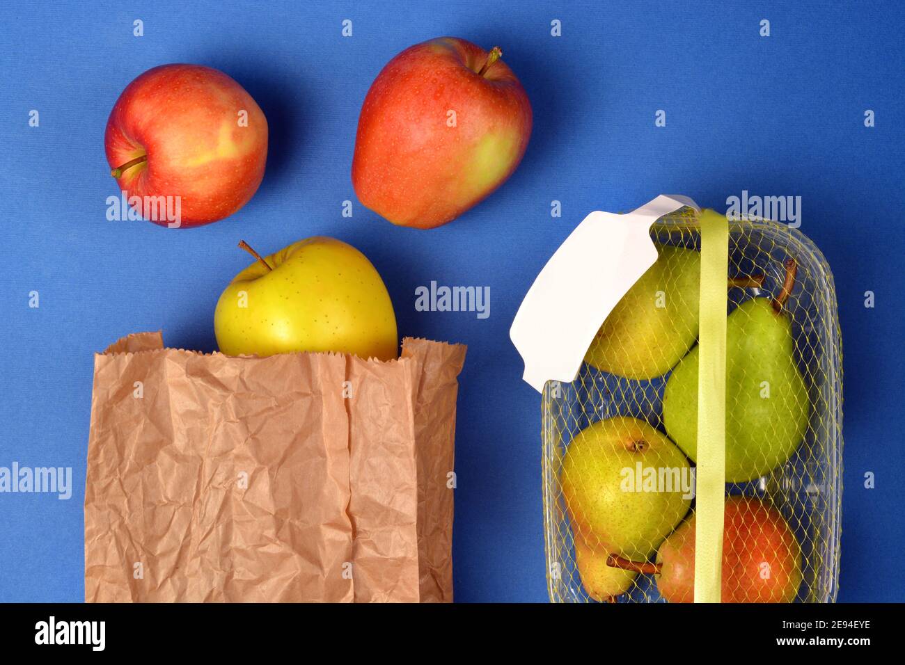 Detail of fruit purchased in plastic packaging and in paper bags Stock Photo