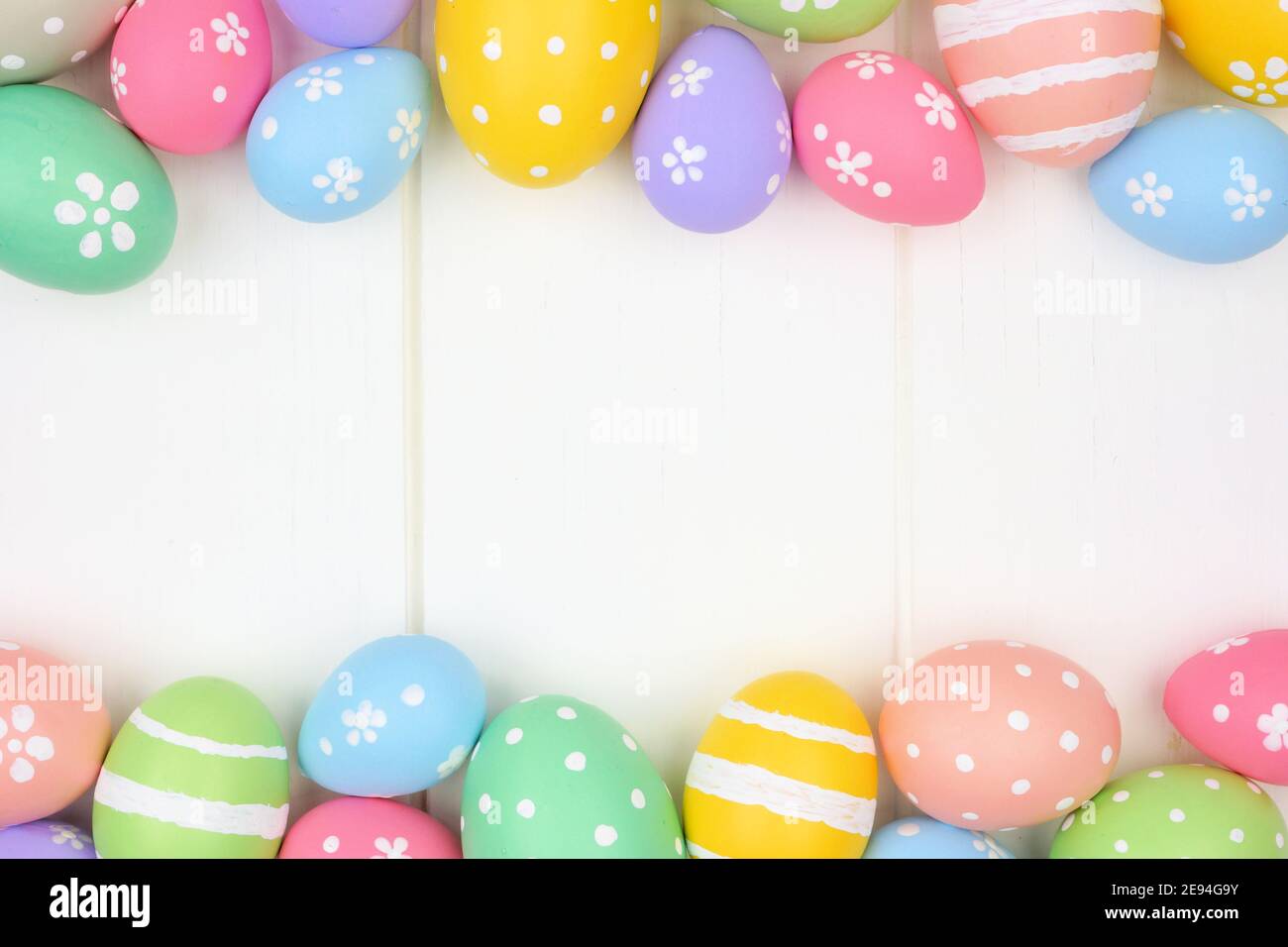 Colorful pastel Easter Egg double border against a white wood ...