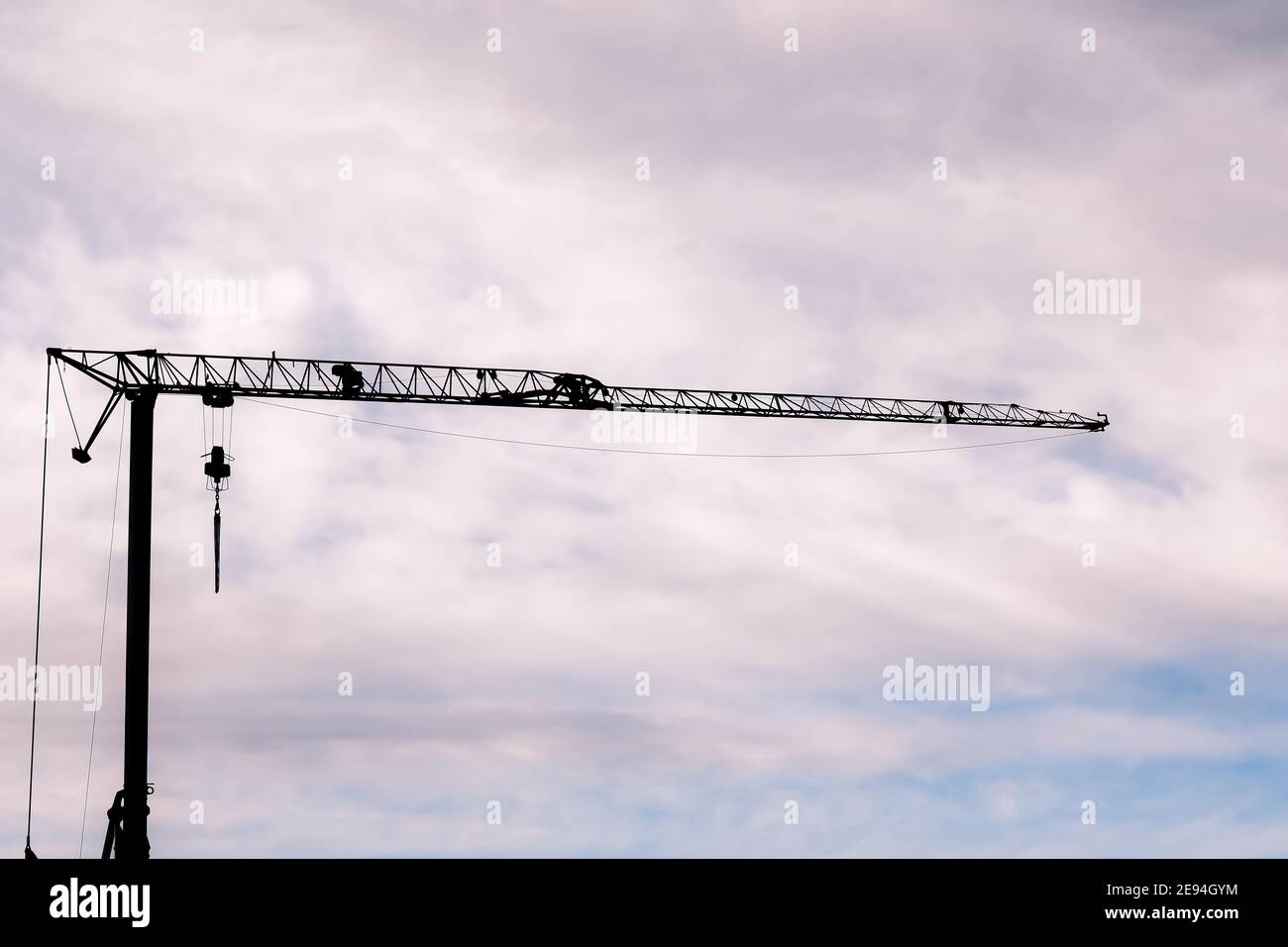 the silhouette of a crane against the cloudy sky Stock Photo - Alamy