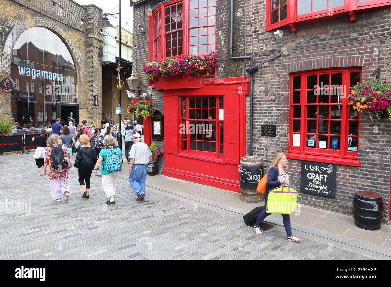 LONDON, UK - JULY 8, 2016: People visit The Anchor pub in London. It is a typical London pub. There are more than 7,000 pubs in London. Stock Photo