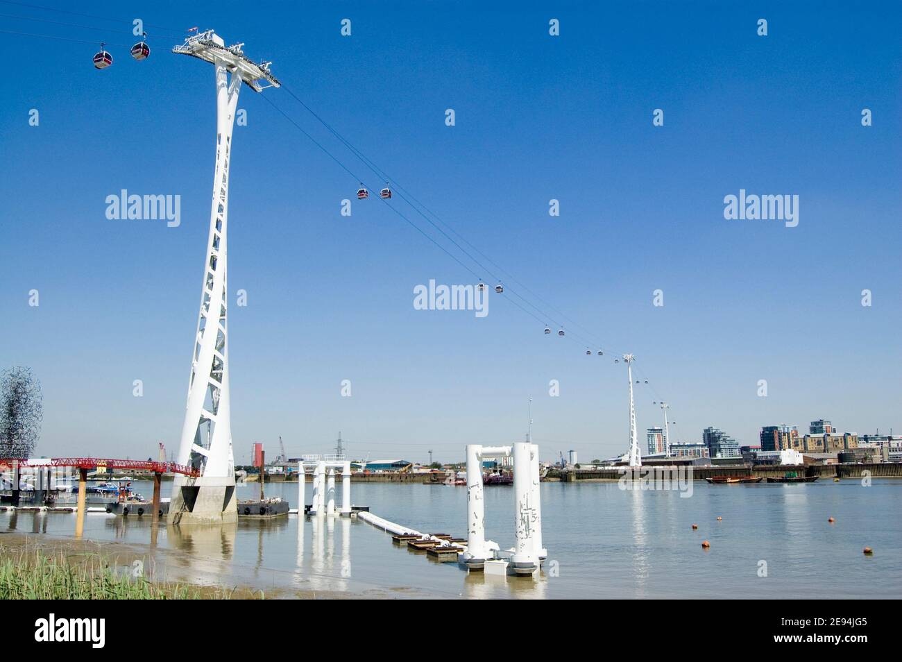 View of the new cable car public transport link between Greenwich and Docklands in the East of London.  View from public footpath. Stock Photo