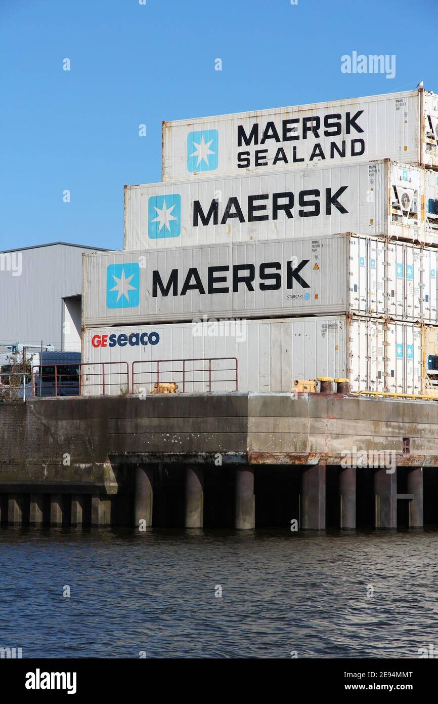 HAMBURG, GERMANY - AUGUST 28, 2014: Maersk shipping containers in Hamburg seaport, Germany. Maersk is a Danish business conglomerate focusing on cargo Stock Photo