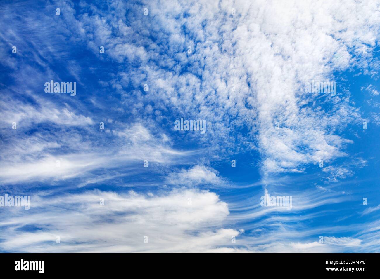Panorama of beautiful blue sky with white curly clouds Stock Photo - Alamy