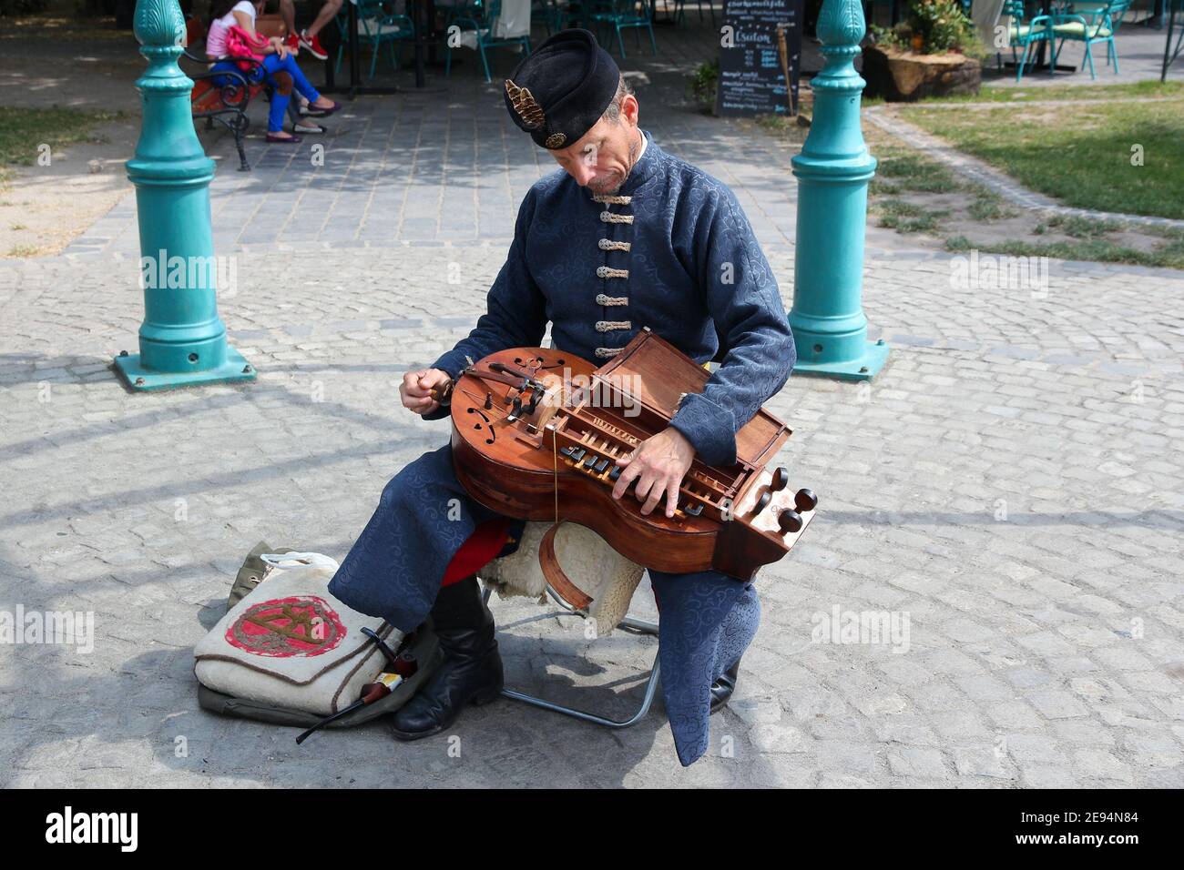 BUDAPEST, HUNGARY JUNE 20, 2014 Street performer plays hurdy gurdy