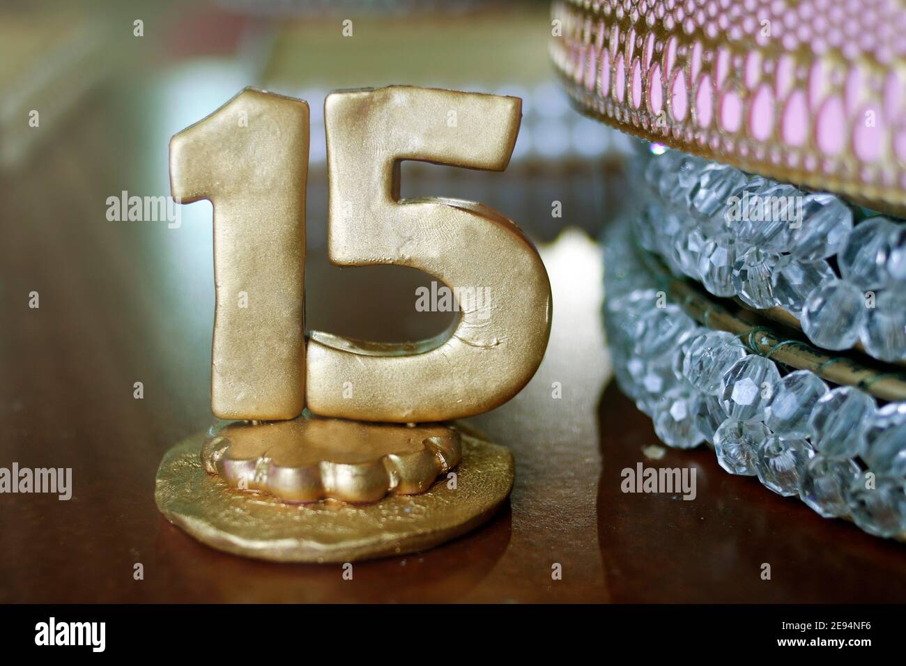 sculpture of number fifteen in golden color - party fifteen years Stock Photo