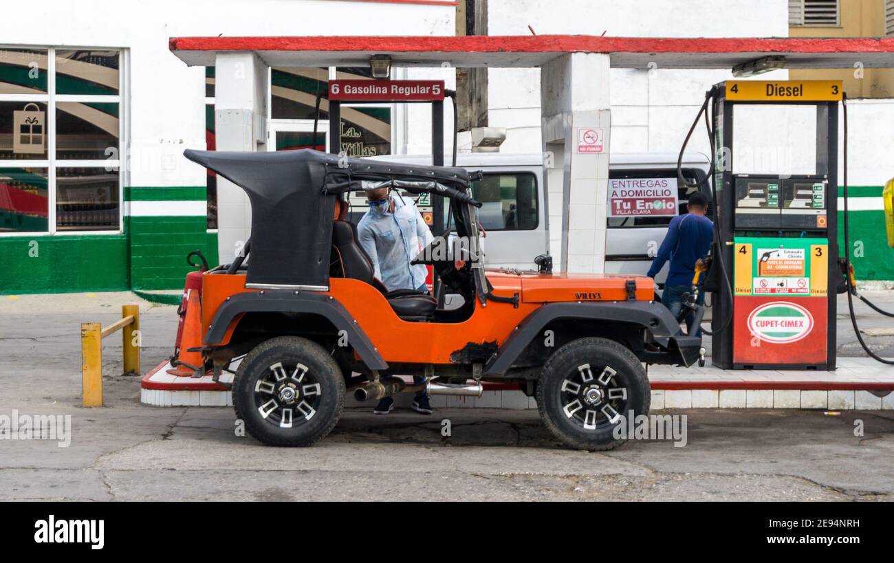 Willys Jeep in a Cimex-Cupet gas station in Santa Clara, Cuba Stock Photo