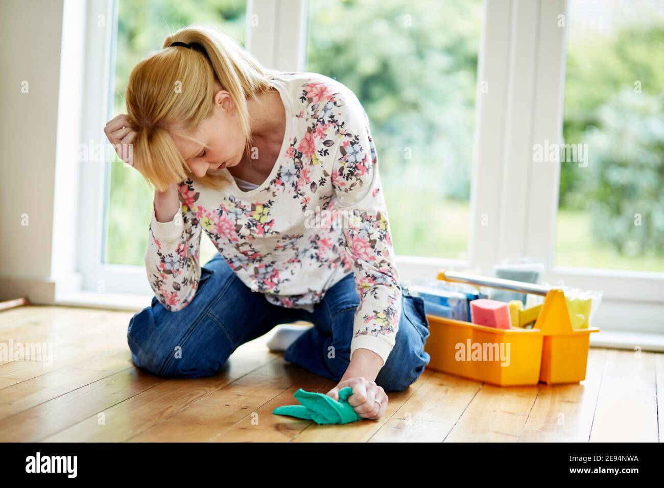 Middle aged woman cleaning Stock Photo