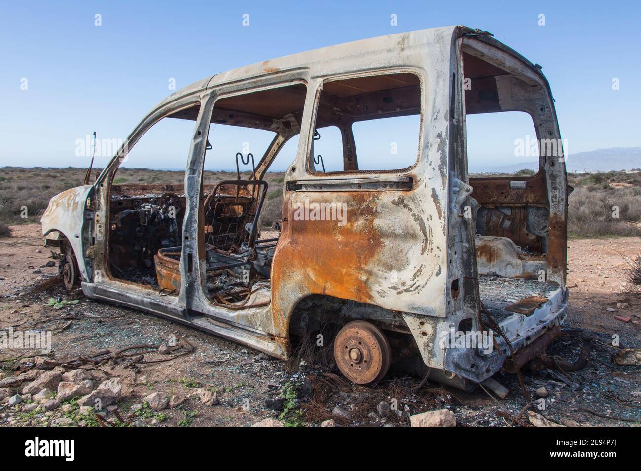 burned car abandoned, car destroyed bo fire, mini van Stock Photo Alamy