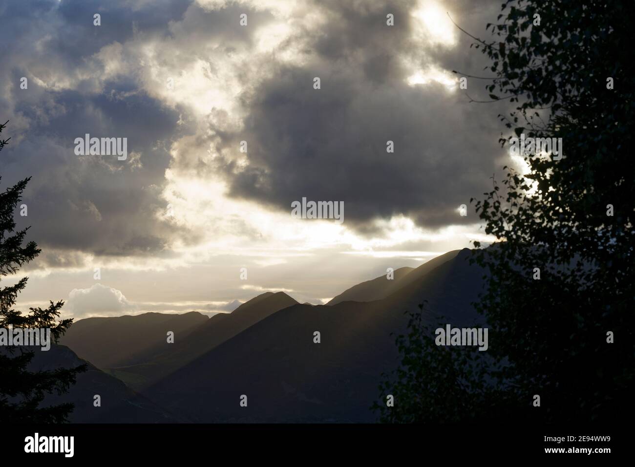 Dramatic silhouette of Catbells mountain over Derwent Water Lake District Cumbria Stock Photo