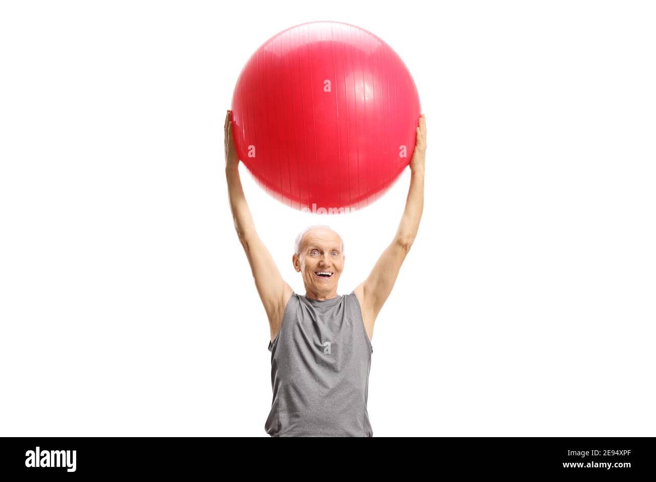 Elderly man lifting a rec fitness ball isolated on white background Stock Photo