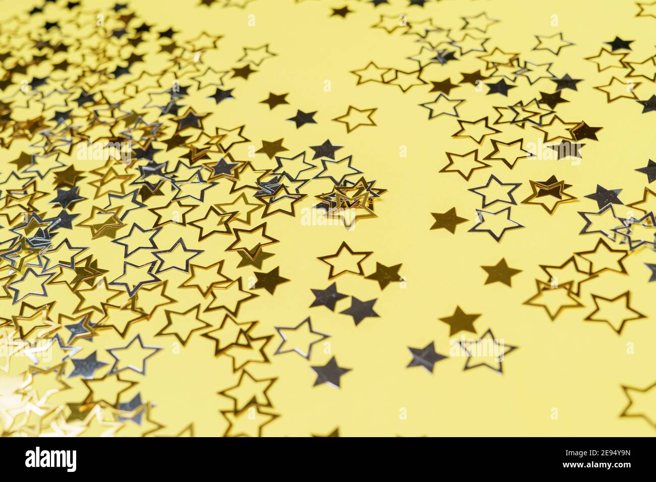 Gold glittering star magic dust on background. Stock Photo by