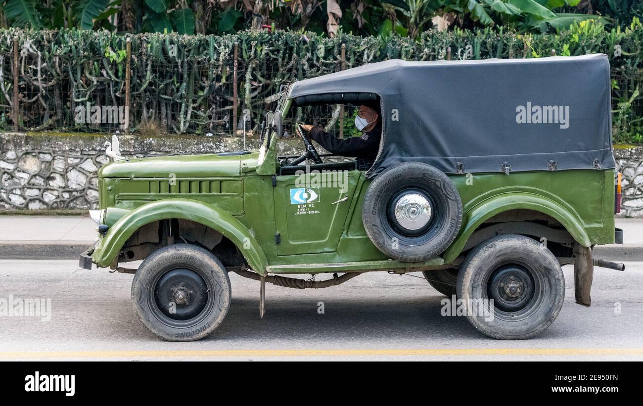 Russian vintage jeep driving in Santa Clara, Cuba Stock Photo
