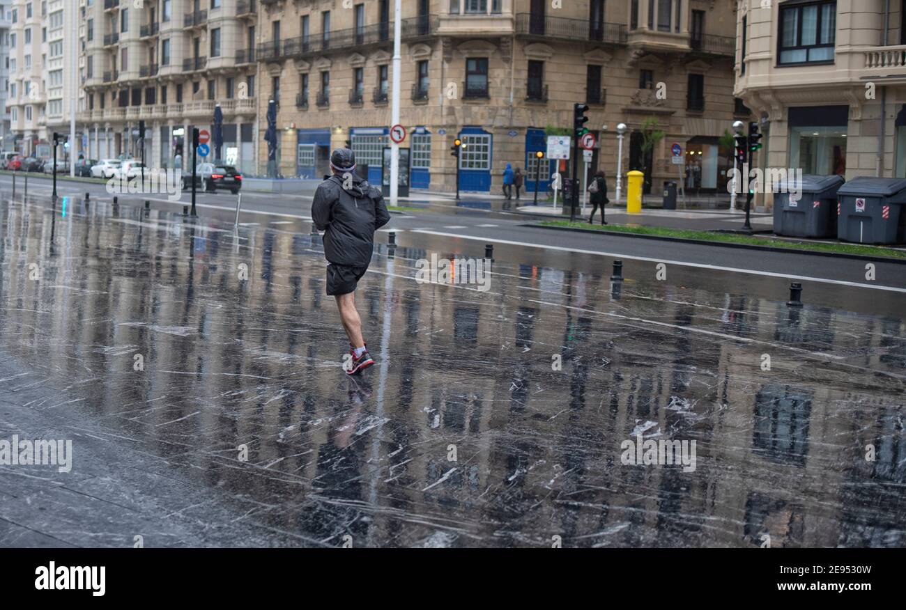 run in the rain Stock Photo