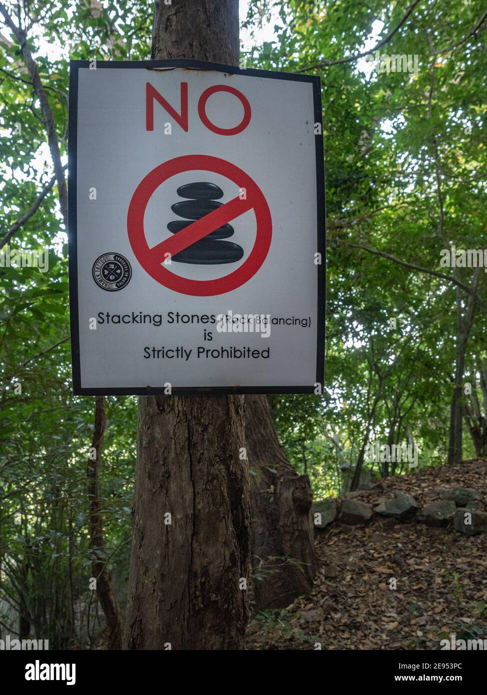No stacking stones sign in forest under Rock Pidurangala. Tourism in ...