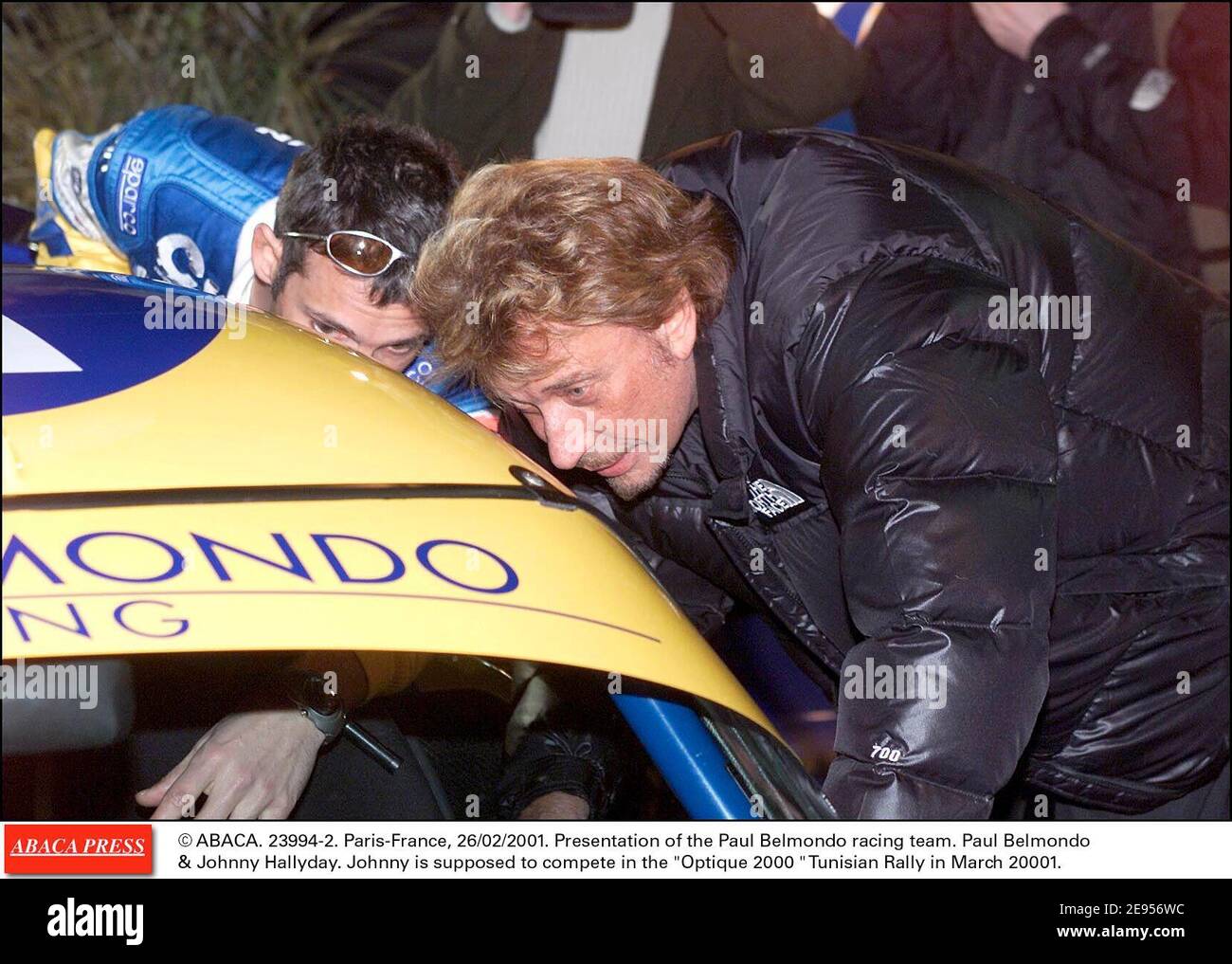 © ABACA. 23994-2. Paris-France, 26/02/2001. Presentation of the Paul Belmondo racing team. Paul Belmondo & Johnny Hallyday. Johnny is supposed to compete in the Optique 2000 Tunisian Rally in March 20001. Stock Photo