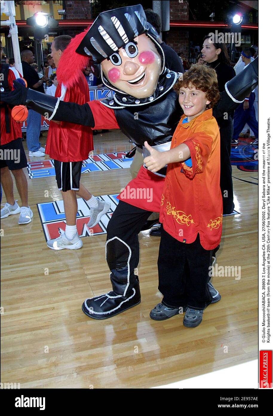 © Giulio Marcocchi/ABACA. 35993-7. Los Angeles-CA- USA, 27/06/2002. Daryl Sabara and the mascot of the Knights basketball team (from the movie) at the 20th Century Fox feature Like Mike premiere at Mann's Village Theatre. Stock Photo