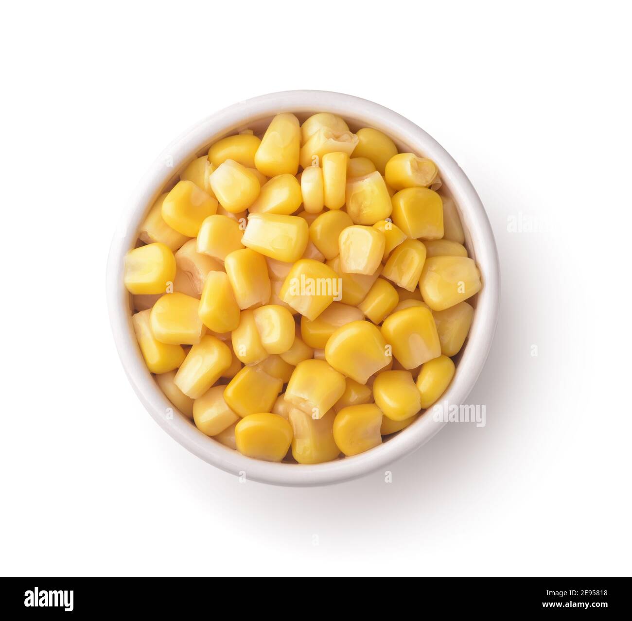 Top view of sweet canned corn in ceramic bowl isolated on white Stock Photo
