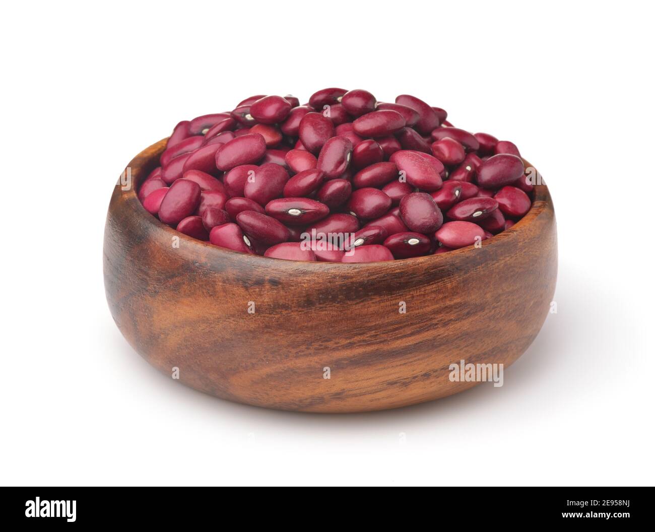 Wooden bowl of dried red kidney beans isolated on white Stock Photo