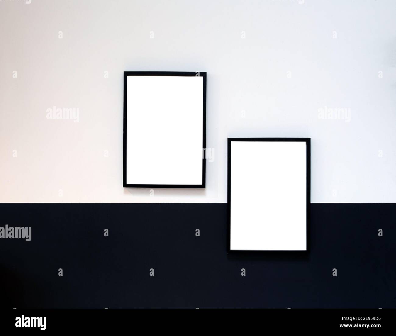 Two blank Poster,canvas,frame hanging on black and white wall, interior design modern mock up frames copy space, Stock Photo