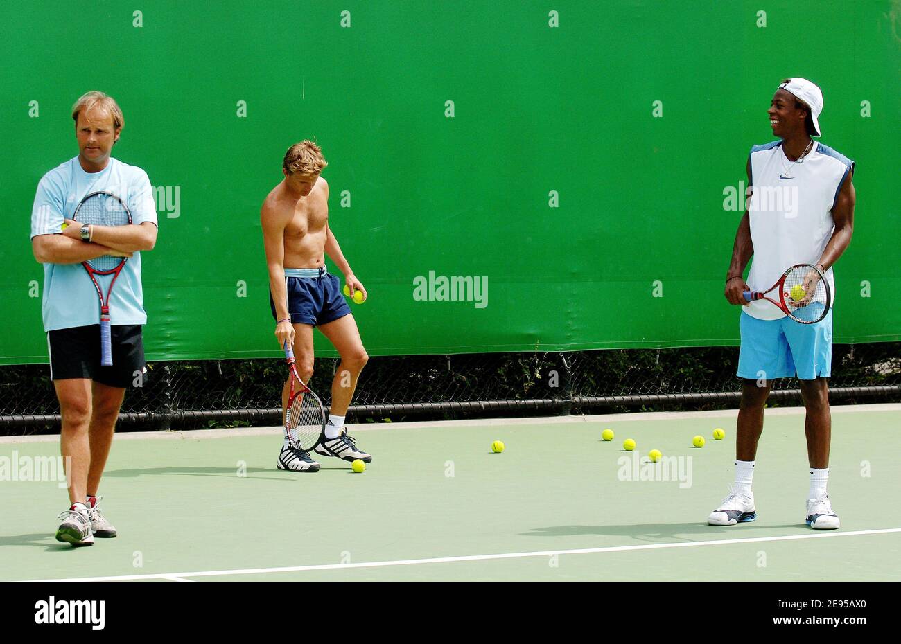 French tennis player Gael Monfils at practice with his tennis coach Thierry  Champion (L) and fitness coach Remy Barbarin at the Australian Tennis open  in Melbourne, Australia on January 15, 2006. Photo