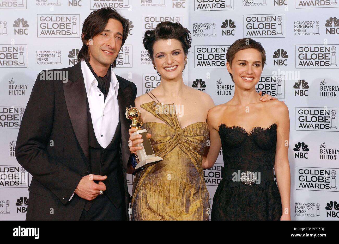 'Rachel Weisz (center), winner of Best Performance by an Actress in a Supporting Role in a Motion Picture for ''The Constant Gardener'', with presenters Adrien Brody and Natalie Portman, in the Pressroom at the 63rd Annual Golden Globe Awards at the Beverly Hilton Hotel in Los Angeles, CA, USA on January 16, 2006. Photo By Hahn-Khayat/ABACAPRESS.COM' Stock Photo