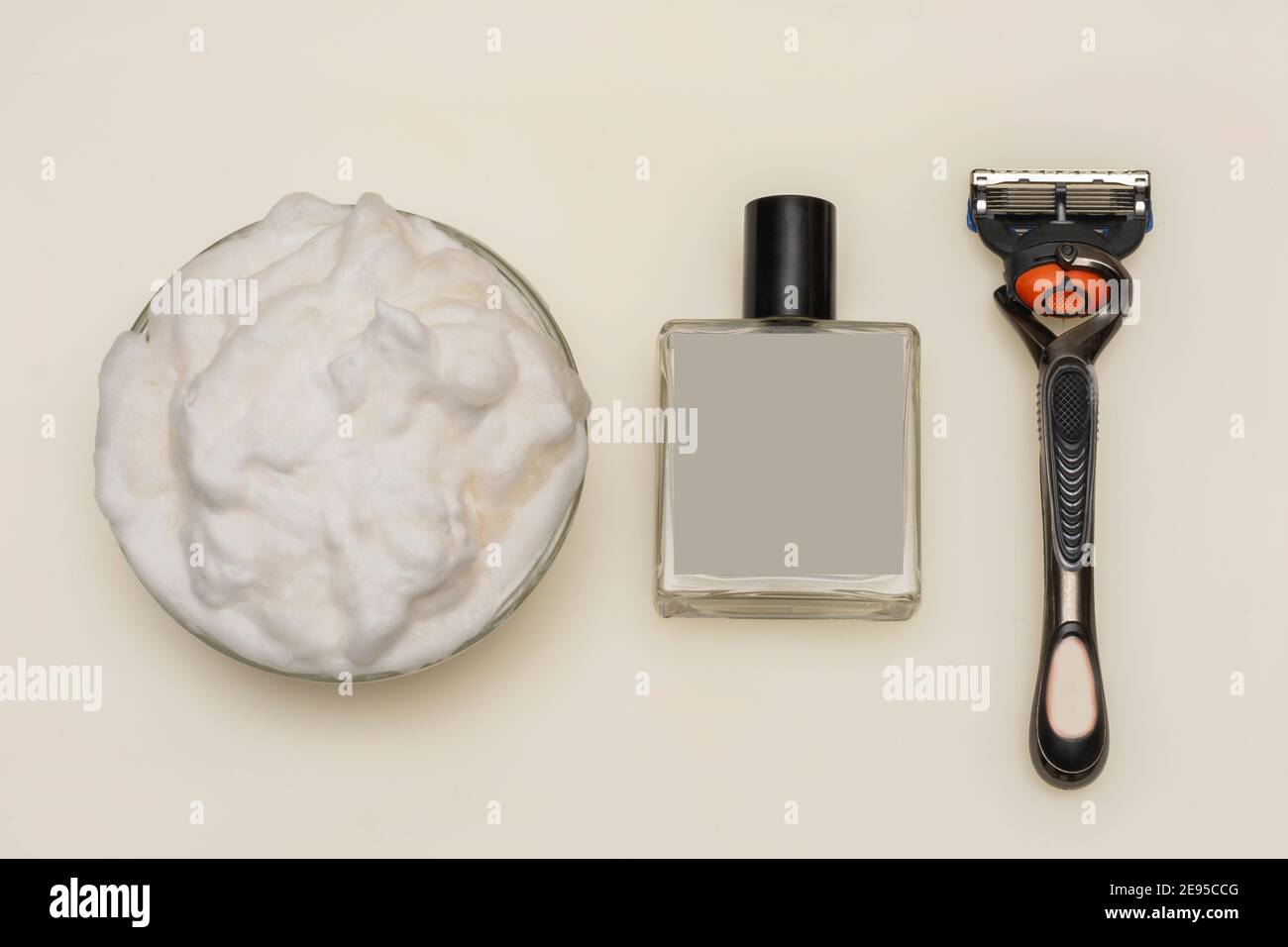 Shaving foam, aftershave with blank label and razor on white background ...