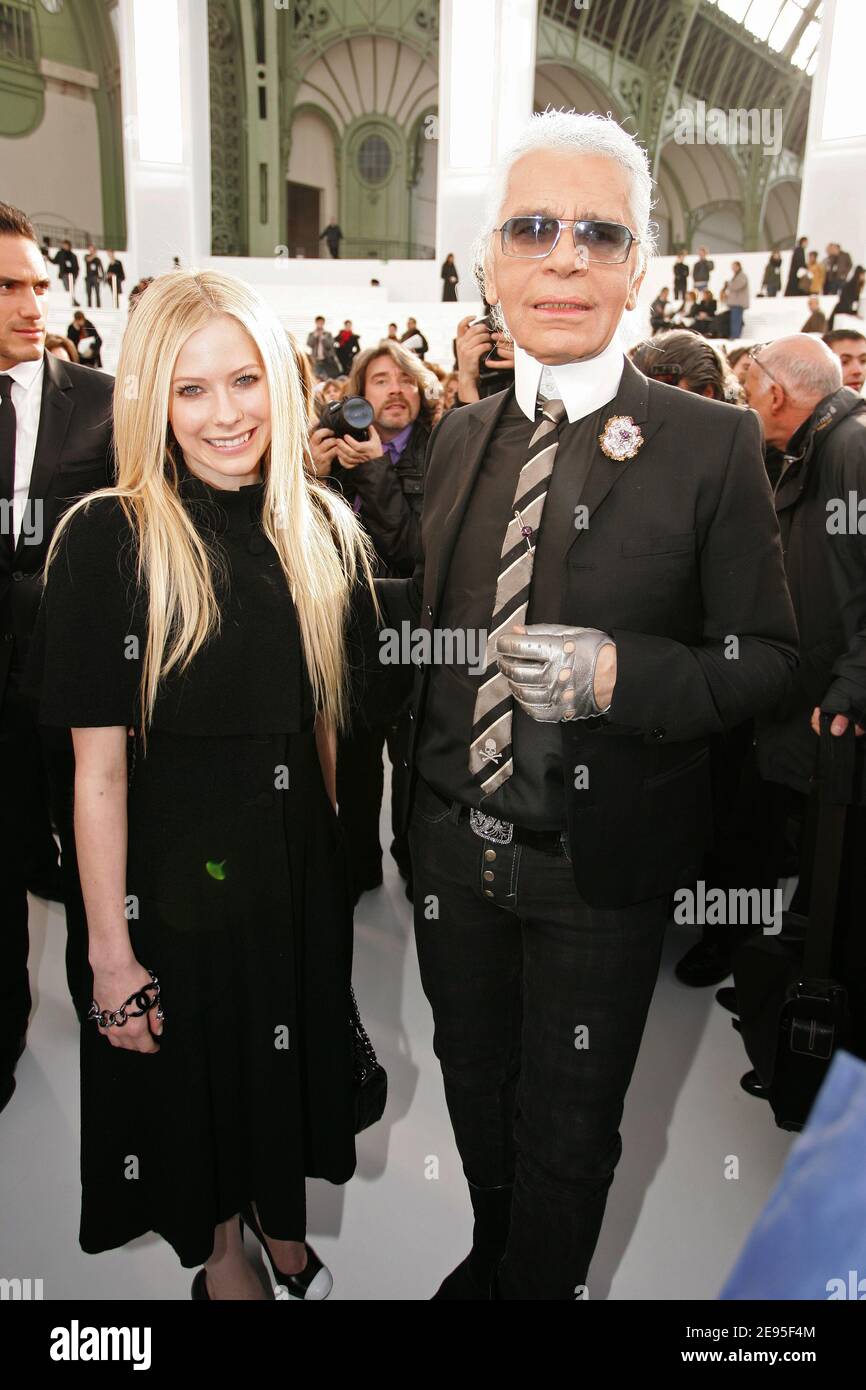 Canadian singer Avril Lavigne and German designer Karl Lagerfeld face the  photographers after the Chanel's Haute-Couture Spring-Summer 2006  collection presentation held at the Grand Palais in Paris, France on  January 24, 2006.