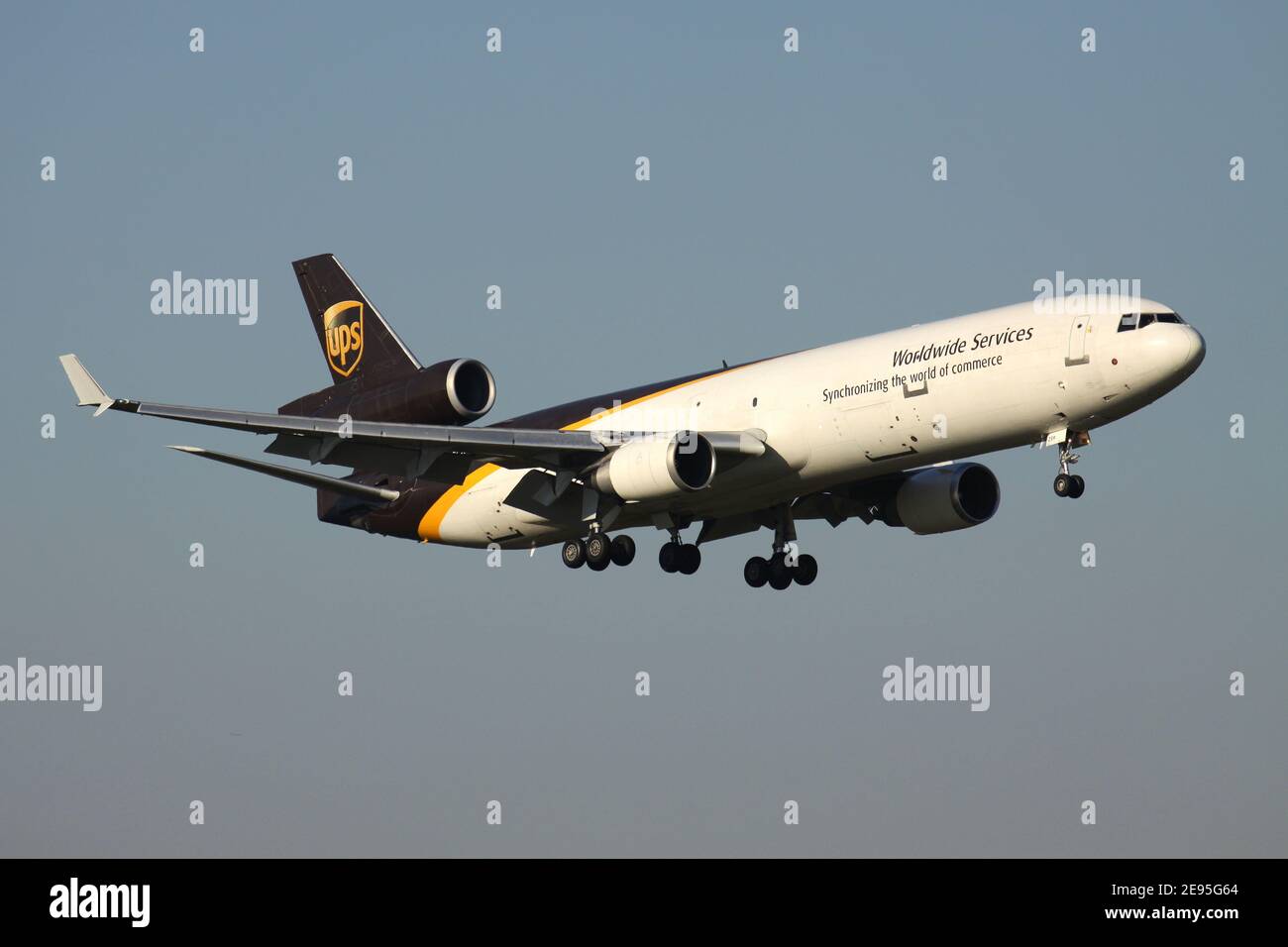 UPS McDonnell Douglas MD-11F with registration N259UP on final for runway 14L of Cologne Bonn Airport. Stock Photo