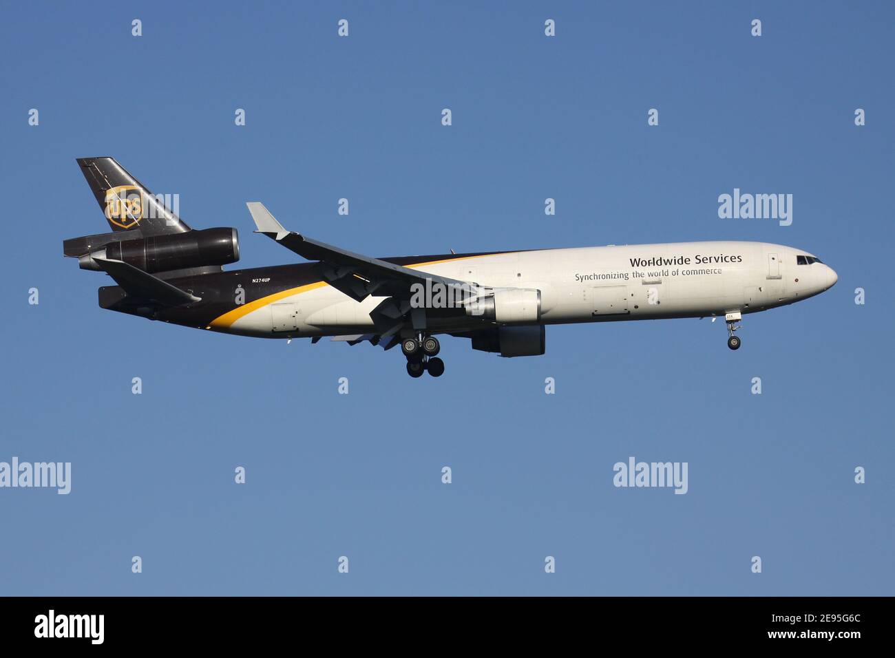 UPS McDonnell Douglas MD-11F with registration N274UP on final for runway 14L of Cologne Bonn Airport. Stock Photo